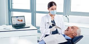 Image of woman using a PrimeScan Scanner on patient